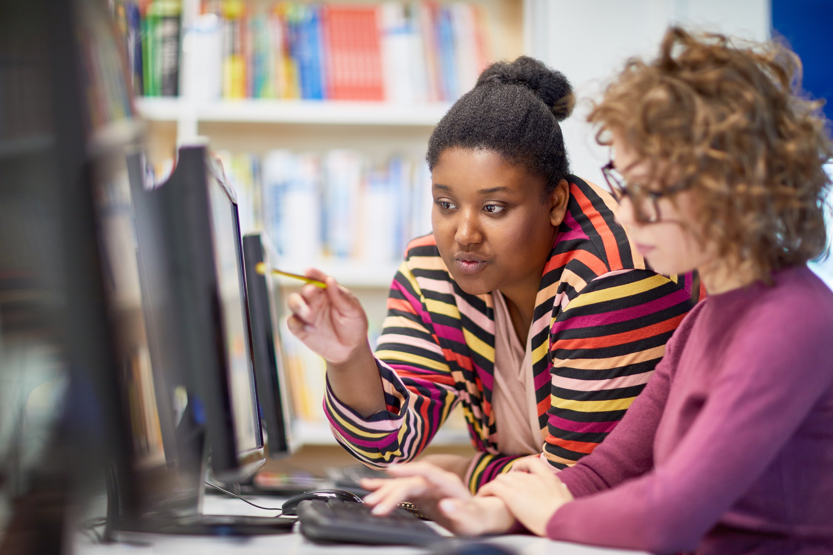 Teacher at computer class